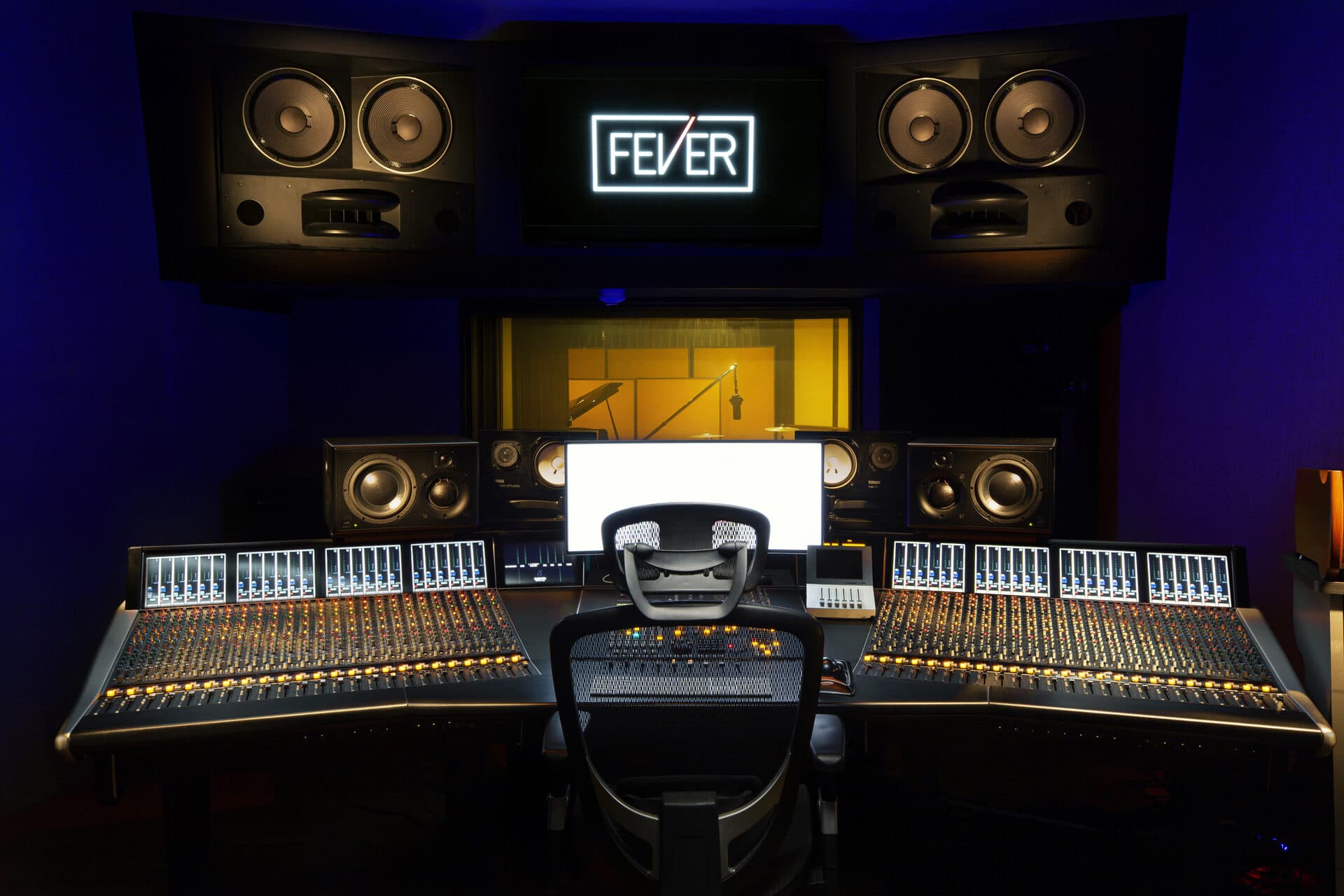 Fever Recording — SSL Duality console under the illuminated FEVER logo